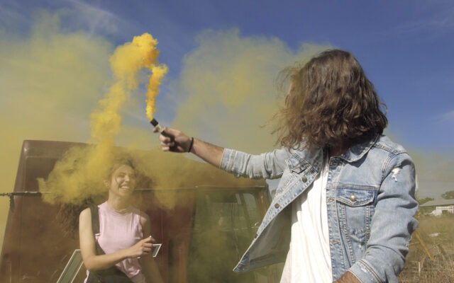 playing-with-a-yellow-smoke-bomb-640x400